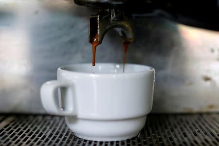 A cup of coffee is served at a coffee shop in Caracas, Venezuela, February 26, 2015. REUTERS/Jorge Silva/File Photo