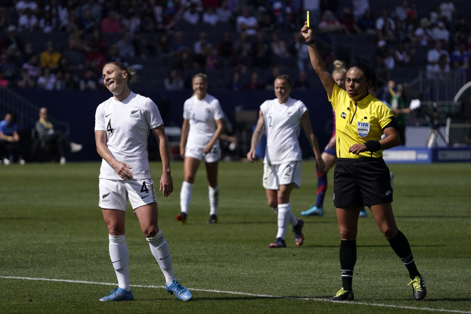 New Zealand defender CJ Bott, left, receives a yellow card during the first half of the 2022 SheBelieves Cup soccer match against the United States Sunday, Feb. 20, 2022, in Carson, Calif. (AP Photo/Mark J. Terrill)