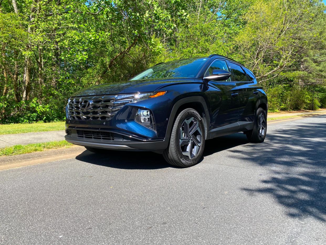 The front end of a 2024 Hyundai Tucson Hybrid SUV.