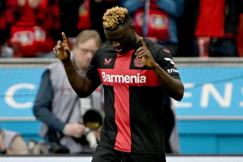 Leverkusen's Victor Boniface celebrates scoring his side's first goal during the German Bundesliga soccer match between Bayer 04 Leverkusen and SV Werder Bremen at BayArena. Federico Gambarini/dpa