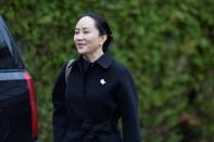 Huawei CFO Meng leaves her home to attend her extradition hearing in Vancouver