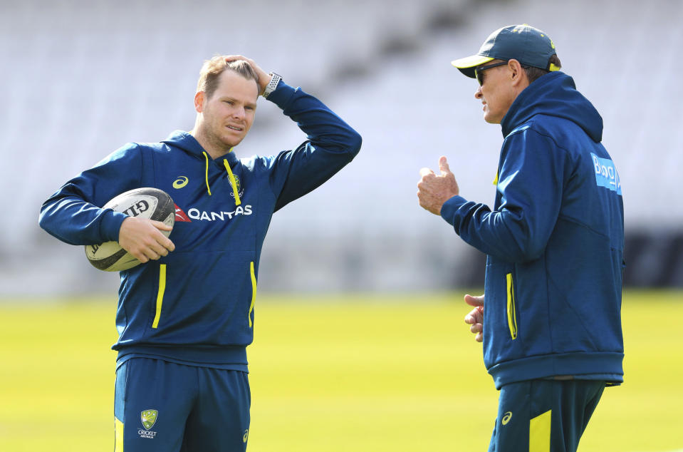 Australia's Steve Smith, left, speaks with Australia batting coach Graeme Hick during a nets session at Headingley, Leeds, England, Tuesday Aug. 20, 2019. England and Australia will begin the 3rd Ashes Test cricket match on Aug. 22. (Mike Egerton/PA via AP)