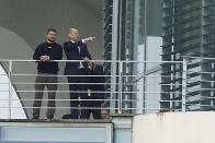 Ukrainian President Volodymyr Zelenskyy, left, shares a word with German Chancellor Olaf Scholz on a balcony of the Federal Chancellery in Berlin, Sunday, May 14, 2023. Zelenskyy was welcomed with military honors Sunday by German Chancellor Olaf Scholz as he made his first visit to Germany since Russia invaded Ukraine. (J'rg Carstensen/dpa via AP)