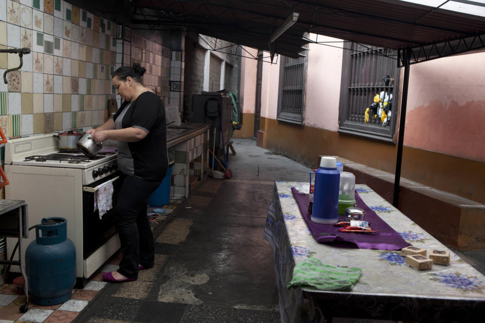 In this Sept. 2, 2013 photo, Nicole Bartscher, a hairdresser from Dortmund , Germany, makes a cake to sell in the kitchen of her new home at a convent in Lima, Peru. Bartscher was arrested in 2010 at Lima's international airport after authorities found cocaine strapped to her body as she tried to fly to the Netherlands. Bartscher says her life has become a purgatory of poverty and stigmatization. No longer behind bars, she can’t support herself and can’t leave the country until she has paid the $2,410 fine she owes. (AP Photo/Martin Mejia)