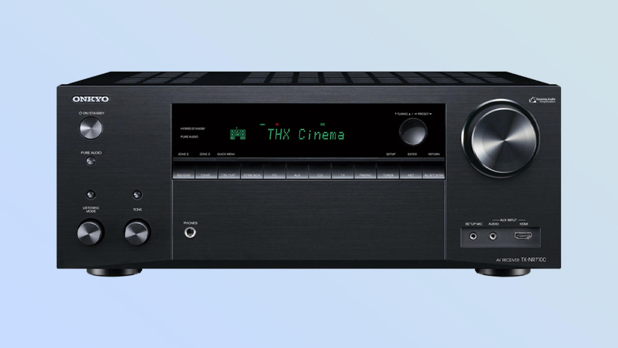  Listing image on blue background showing front panel of Onkyo TX-NR7100 AV receiver. 