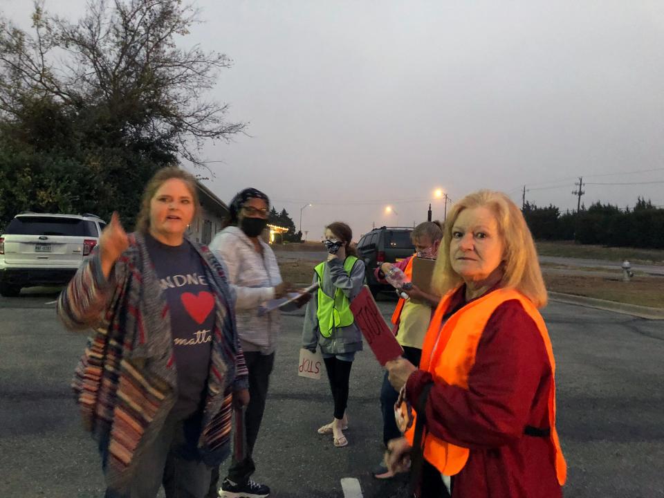 Crystal Brooks and others gather to discuss turkey giveaway in this 2020 photo.