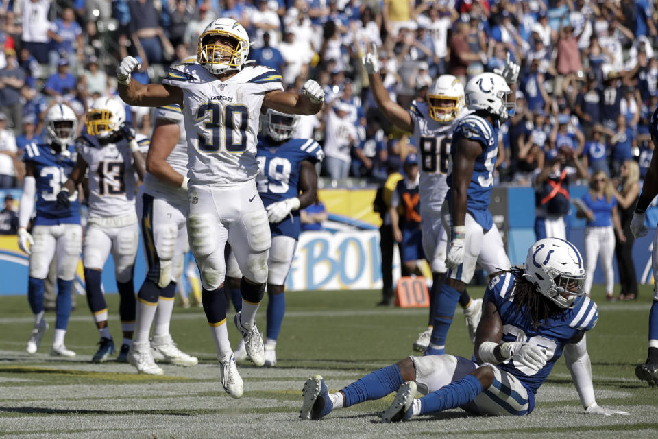 Los Angeles Chargers running back Austin Ekeler (30) celebrates after scoring the winning touchdown during overtime in an NFL football game against the Indianapolis Colts Sunday, Sept. 8, 2019, in Carson, Calif. (AP Photo/Marcio Jose Sanchez)