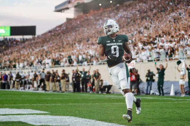 MIchigan State football glows with neon uniforms vs. Western Michigan