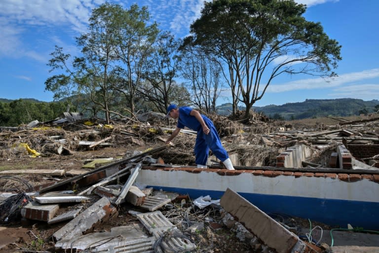 Pig farmer Vernei Kunz inspects the damage caused when the Forqueta river burst its banks in Travesseiro, a quiet farming town southern Brazil (Nelson ALMEIDA)