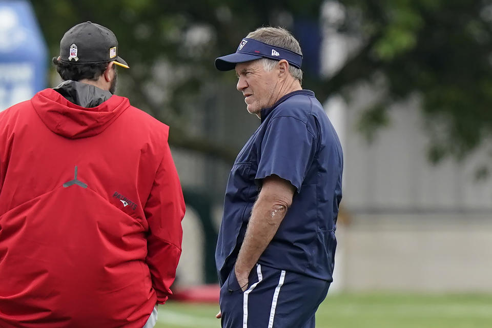 New England Patriots head coach Bill Belichick, right, speaks with Matt Patricia, left, during an NFL football practice, Tuesday, June 15, 2021, in Foxborough, Mass. (AP Photo/Steven Senne)