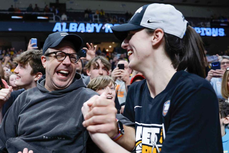 <p>Sarah Stier/Getty</p> Caitlin Clark #22 of the Iowa Hawkeyes celebrates with Jason Sudeikis