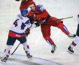 Slovakia's Michal Sersen (L) fights with Russia's Alexander Syomin during the final game of the IIHF International Ice Hockey World Championship in Helsinki on May 20, 2012. AFP PHOTO/ ALEXANDER NEMENOVALEXANDER NEMENOV/AFP/GettyImages