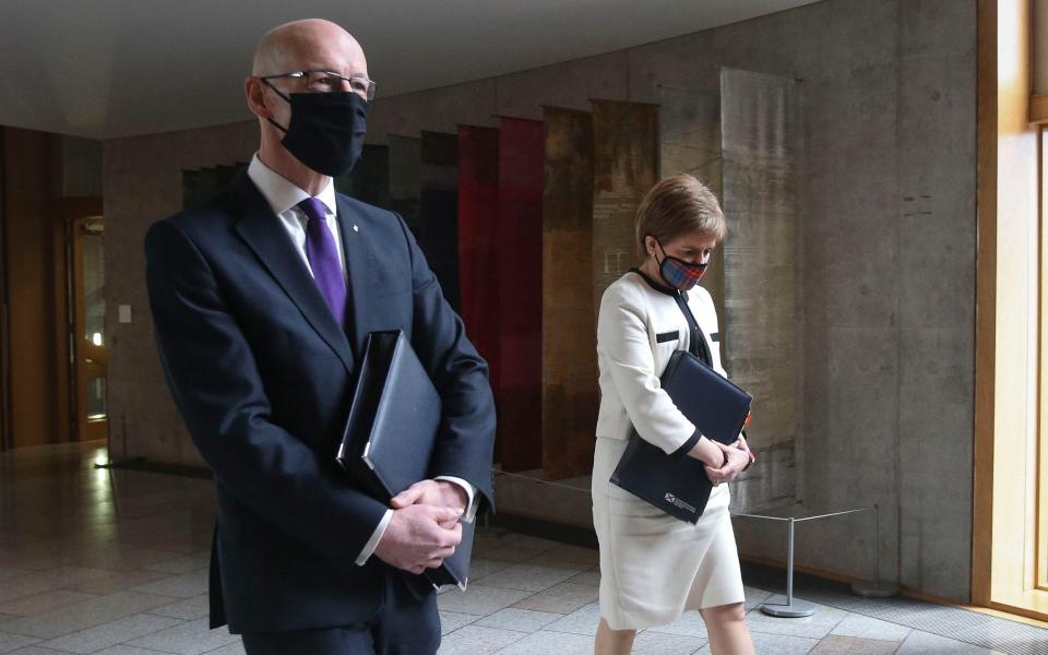 John Swinney and Nicola Sturgeon - PA