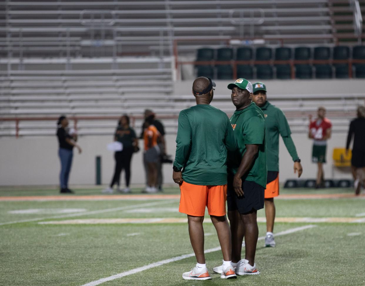 Head Coach James Colzie III speaks to the other FAMU football coaches at their first team practice on Thursday, July 25, 2024.