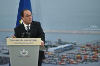 French President Francois Hollande speaks at a ceremony to mark the laying of the first stone of the extension of the port of Calais, on September 26, 2016