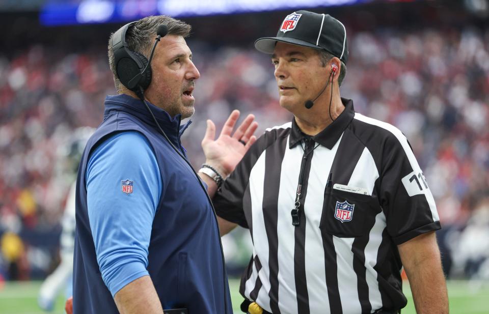 Titans head coach Mike Vrabel talks with an official during the first quarter at the Houston Texans, Dec 31, 2023.
