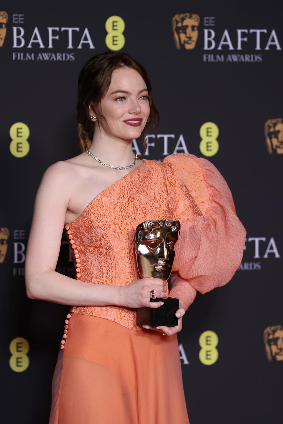 Emma Stone poses in the Winners Room with the Leading Actress Award during the EE BAFTA Film Awards 2024 at The Royal Festival Hall on February 18, 2024 in London, England.