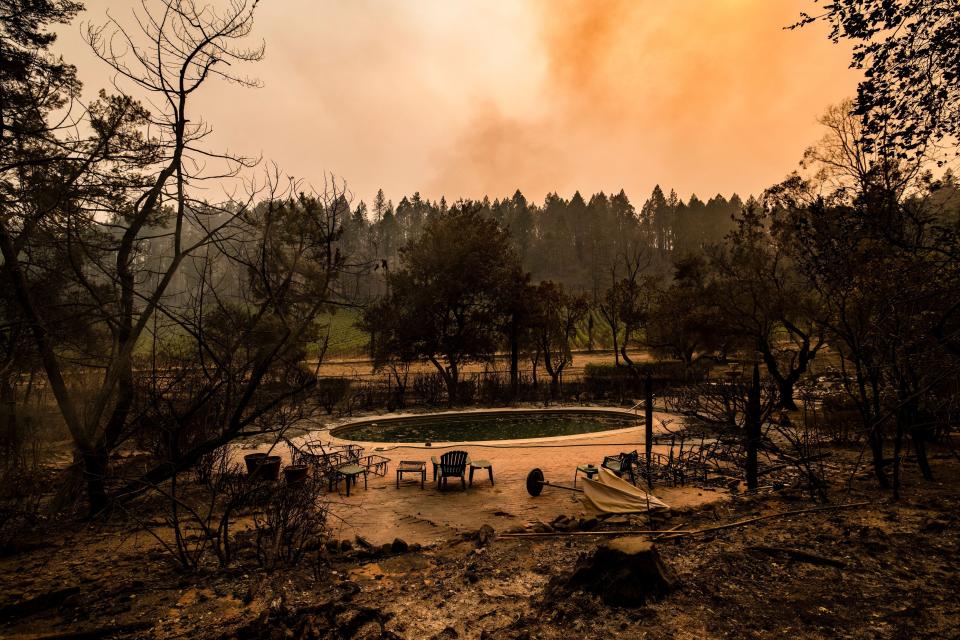 A swimming pool is the only thing left at a burned Napa Valley home on Monday. 