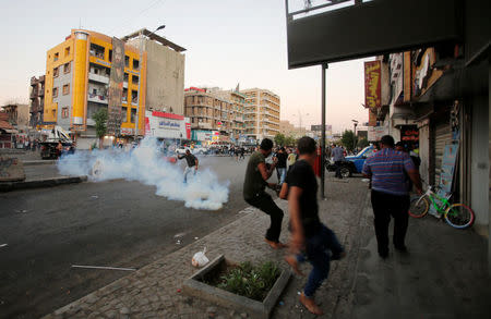 Protesters are being dispersed by riot police during the protest in Baghdad, Iraq July 20, 2018. REUTERS/Khalid Al-Mousily