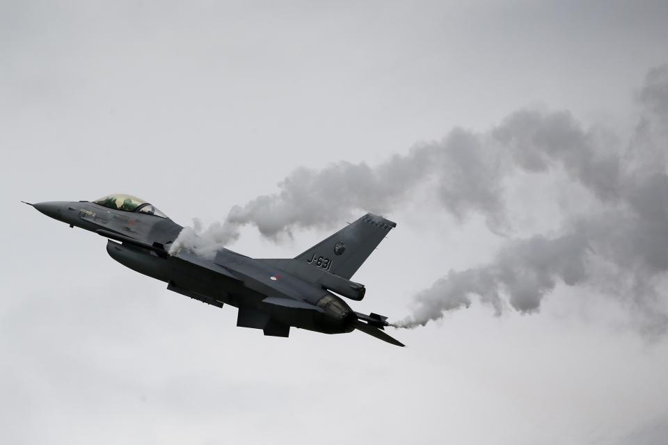 A General Dynamics F-16M Fighting Falcon of the Royal Netherlands Air Force performs during The Royal International Air Tattoo at the RAF in Fairford