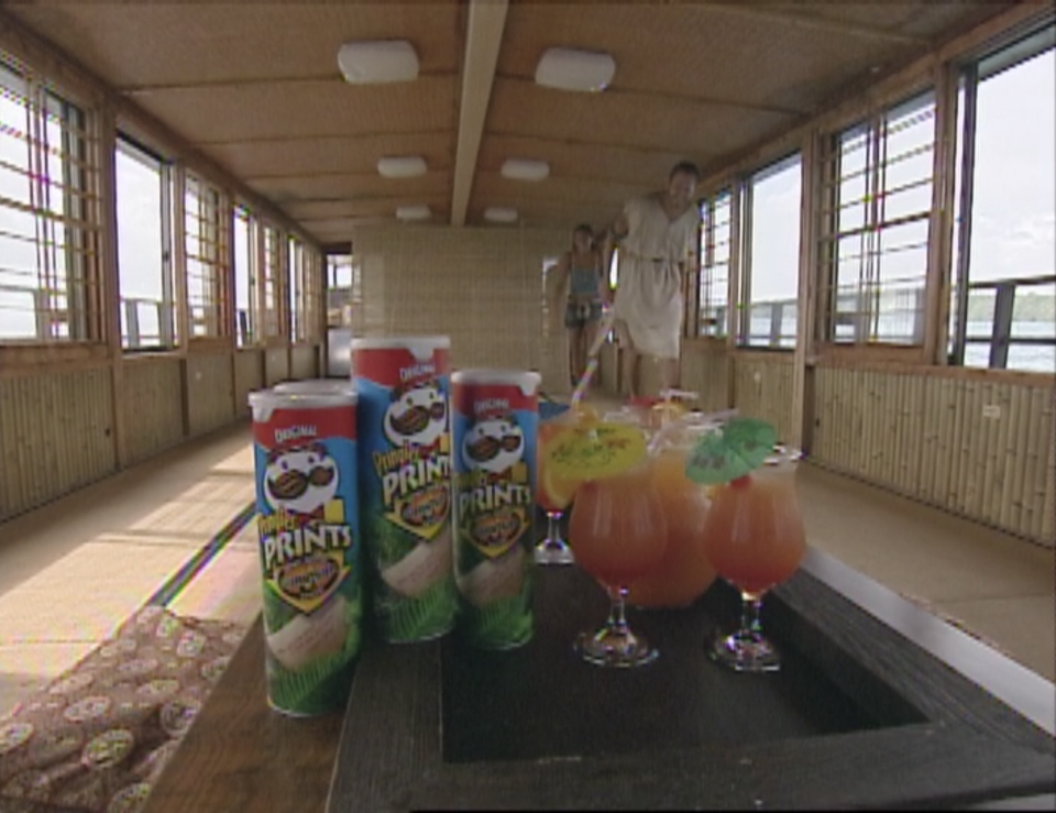 Several cans of Survivor Trivia Pringles next to Mai-Tais