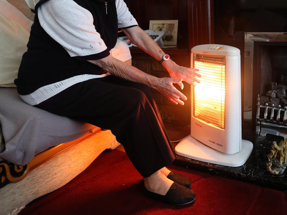 EMBARGOED TO 0001 WEDNESDAY AUGUST 17 File photo dated 19/11/14 of an elderly lady with her electric fire on at home. 