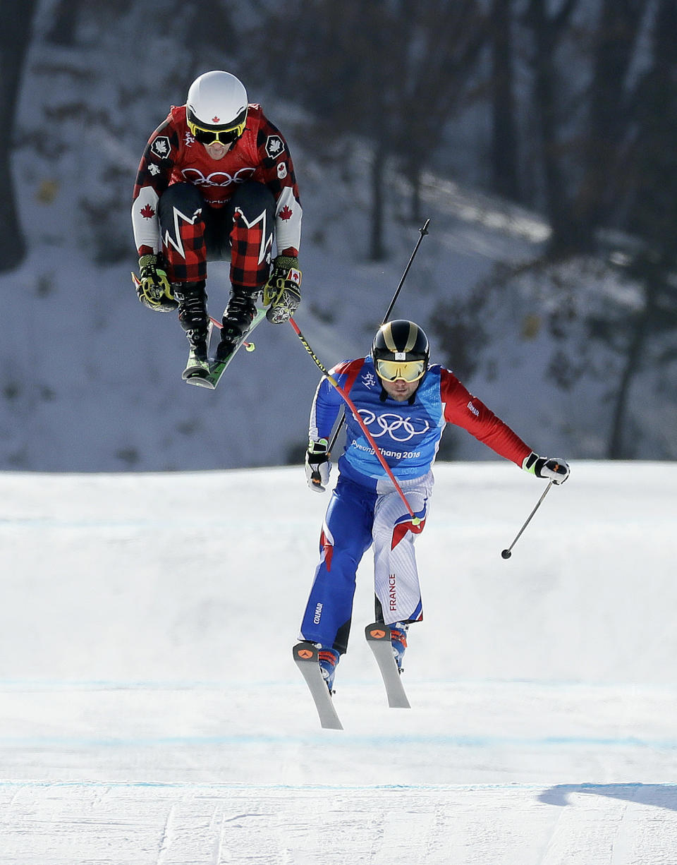 <p>Kevin Drury, of Canada, left, and Arnaud Bovolenta, of France, run the course during the men’s ski cross quarterfinal at Phoenix Snow Park at the 2018 Winter Olympics in Pyeongchang, South Korea, Wednesday, Feb. 21, 2018. (AP Photo/Kin Cheung) </p>