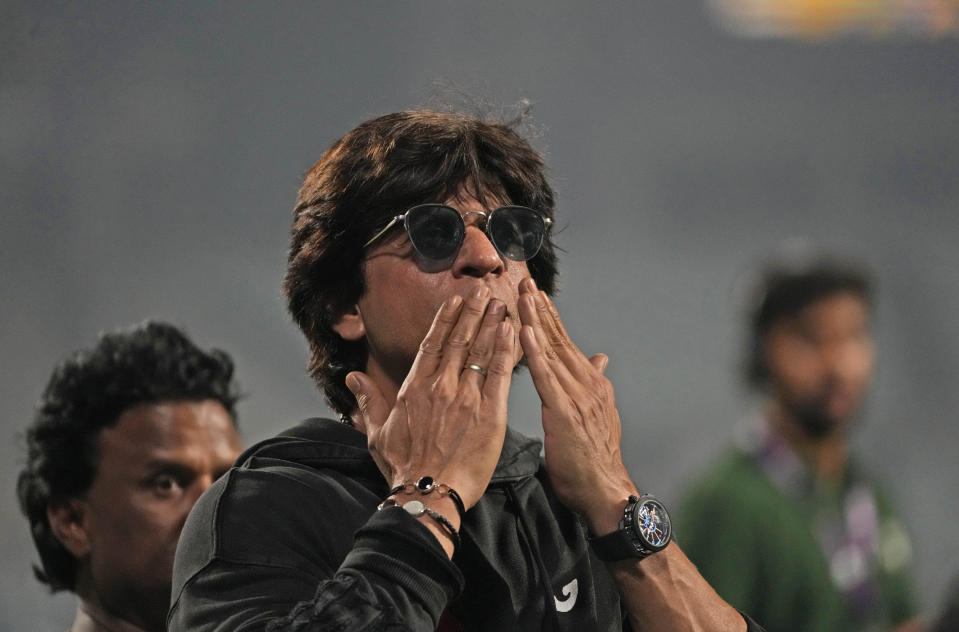 Bollywood superstar Shah Rukh Khan acknowledges the crowd after his team Kolkata Knight Riders' won the Indian Premier League (IPL) cricket match against Royal Challengers Bangalore in Kolkata, India, Thursday, April 6, 2023. (AP Photo/Bikas Das)