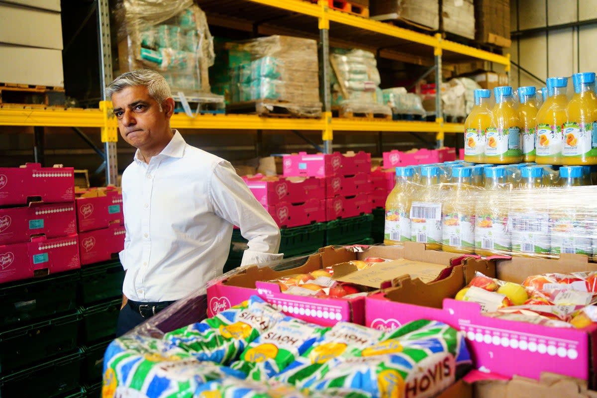 Sadiq Khan visits a food distribution hub in Newham (PA)