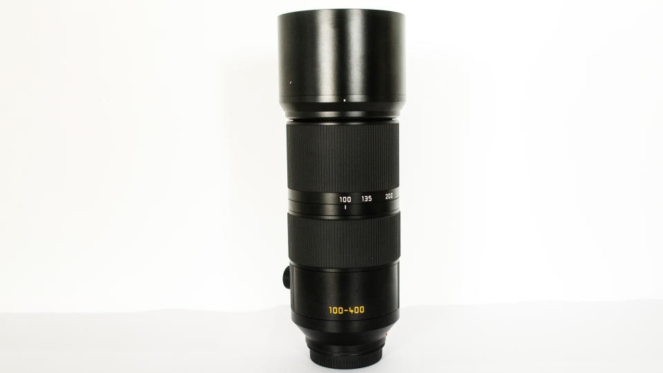 Leica 100-400mm Vario-Elmarit-SL f/5-6.3 stood tall on a white background