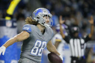 Detroit Lions tight end T.J. Hockenson (88) reacts after catching a pass in the end zone for a touchdown during the first half of an NFL football game against the Minnesota Vikings, Sunday, Dec. 5, 2021, in Detroit. (AP Photo/Duane Burleson)