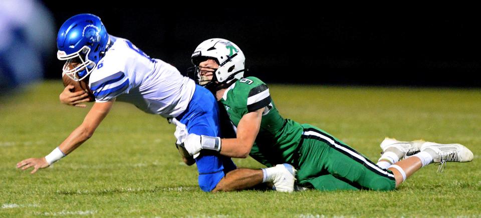 Athens High School's Zac Laird sacks Auburn's Quarterback Talin Kern during the game Friday, Sept. 15, 2023.