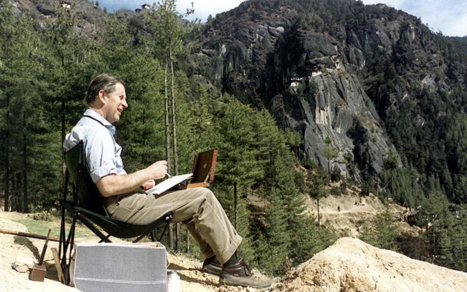 Prince Charles painting a watercolour in the Bhutan Himalayas - Alpha Photo