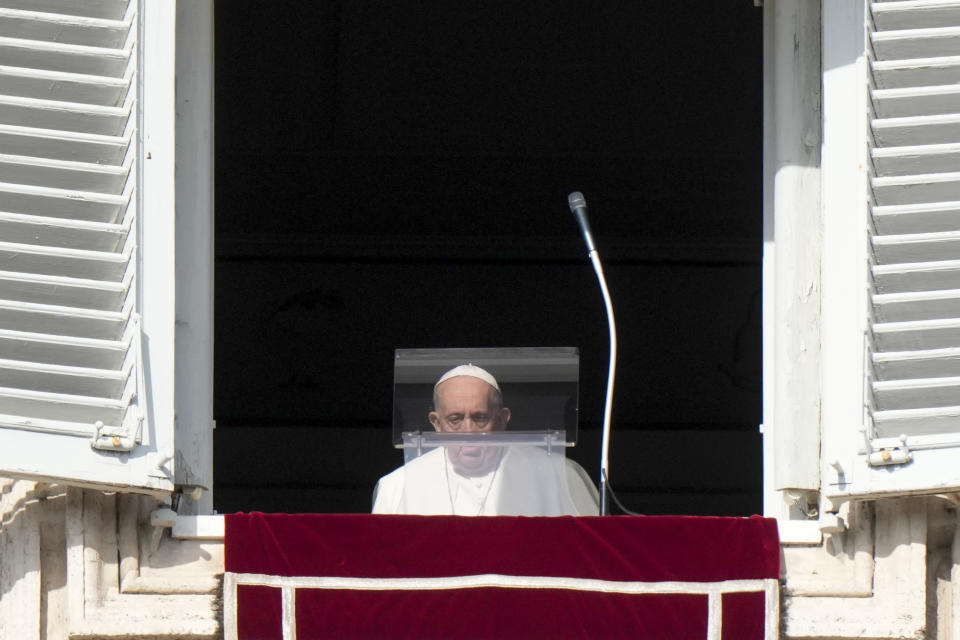 Pope Francis arrives to recite the Angelus noon prayer from the window of his studio overlooking St.Peter's Square, at the Vatican, Sunday, Jan. 23, 2022. (AP Photo/Andrew Medichini)