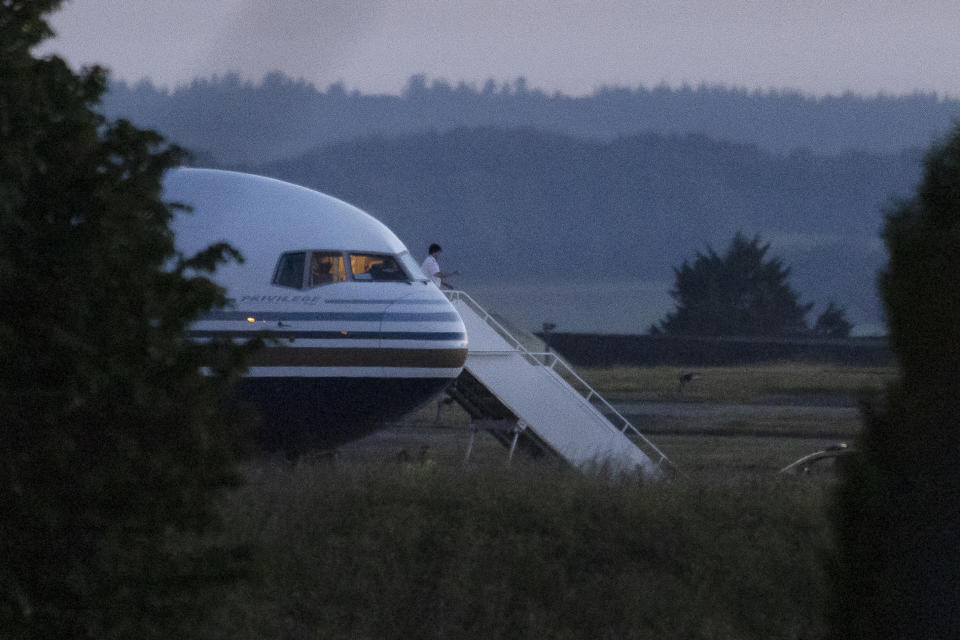 AMESBURY, WILTSHIRE - JUNE 14: A pilot gestures from the grounded Rwanda deportation flight EC-LZO Boeing 767 at Boscombe Down Air Base, on June 14, 2022 in Boscombe Down near Amesbury, Wiltshire, England. The flight taking asylum seekers from the UK to Rwanda has been grounded at the last minute after intervention of the European Court of Human Rights. (Photo by Dan Kitwood/Getty Images)