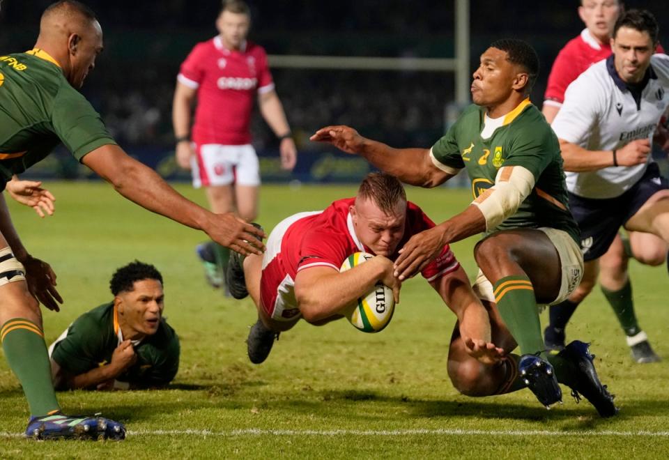 Dewi Lake dives to score a try for Wales against South Africa in Pretoria (Themba Hadebe/AP) (AP)