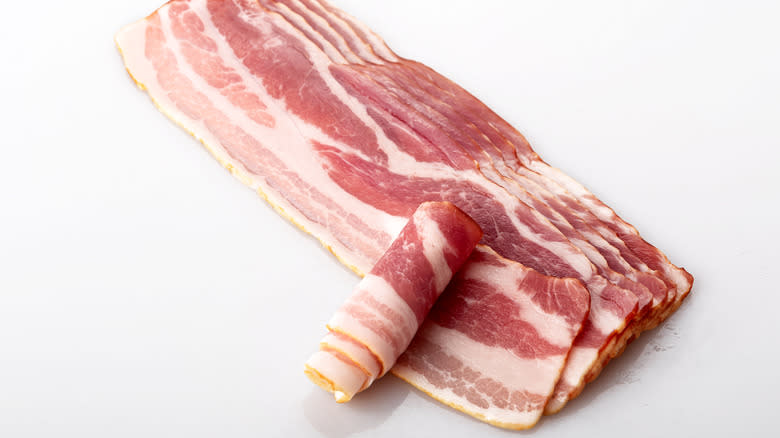 Strips of raw bacon