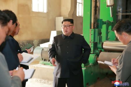 FILE PHOTO: North Korea's leader Kim Jong Un tours a factory in Sinuiju, North Korea, in this undated photo released by North Korea's Korean Central News Agency (KCNA) July 2, 2018. REUTERS/KCNA