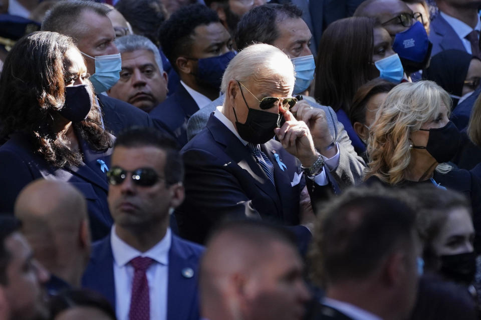 Former first lady Michelle Obama, President Joe Biden and first lady Jill Biden attend a ceremony marking the 20th anniversary of the Sept. 11, 2001, terrorist attacks at the National September 11 Memorial and Museum in New York, Saturday, Sept. 11, 2021. (AP Photo/Evan Vucci)