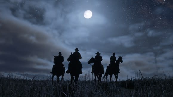 Four cowboys on horseback riding the plains silhouetted by a full moon, in a scene from Red Dead Redemption 2.