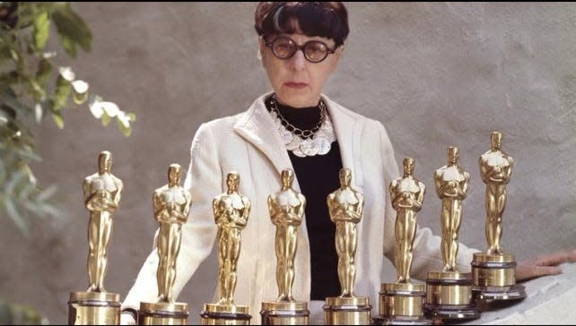 Costume Designer Edith Head poses with her eight Academy Awards.
