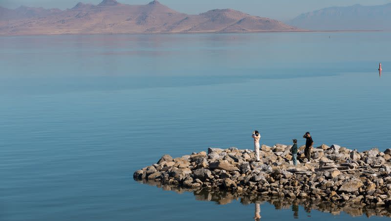 Visitors take photos at Great Salt Lake State Park in Magna on Friday, Oct. 6, 2023.