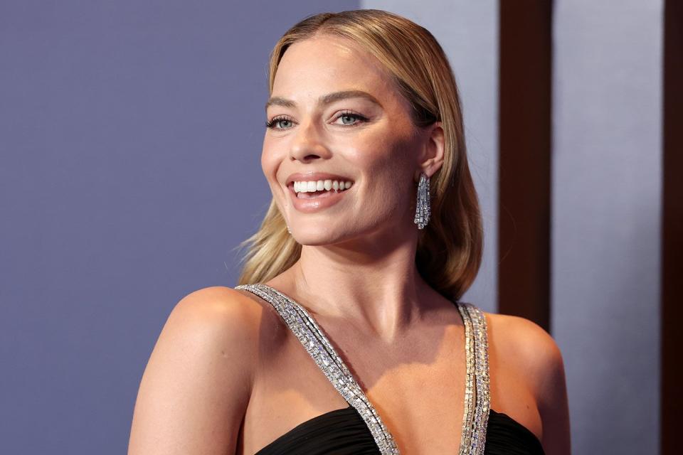 <p>Christopher Polk/WWD via Getty </p> Margot Robbie at the 14th Governors Awards held at The Ray Dolby Ballroom at Ovation Hollywood on January 9, 2024