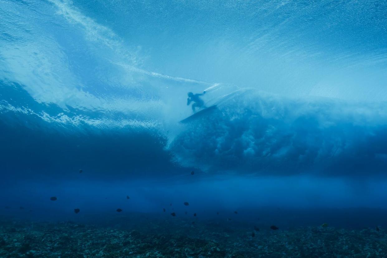 Brazilian surfer Tatiana Weston-Webb does a training run off the coast of Tahiti.