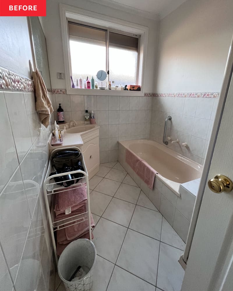 A white bathroom with beige bath and sink.