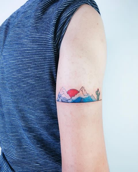 <p>Hail from the mountains? Recall your roots with a small tattoo of the sunsetting over a mountain range.</p><p><a href="https://www.instagram.com/p/BwQF6hhBvQ9/" rel="nofollow noopener" target="_blank" data-ylk="slk:See the original post on Instagram;elm:context_link;itc:0;sec:content-canvas" class="link ">See the original post on Instagram</a></p>