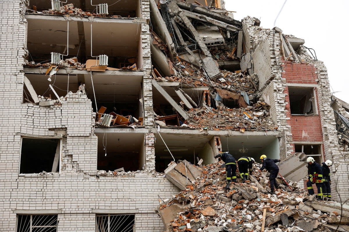 Rescuers work at the site of a destroyed building during a Russian missile strike in Chernihiv (REUTERS)