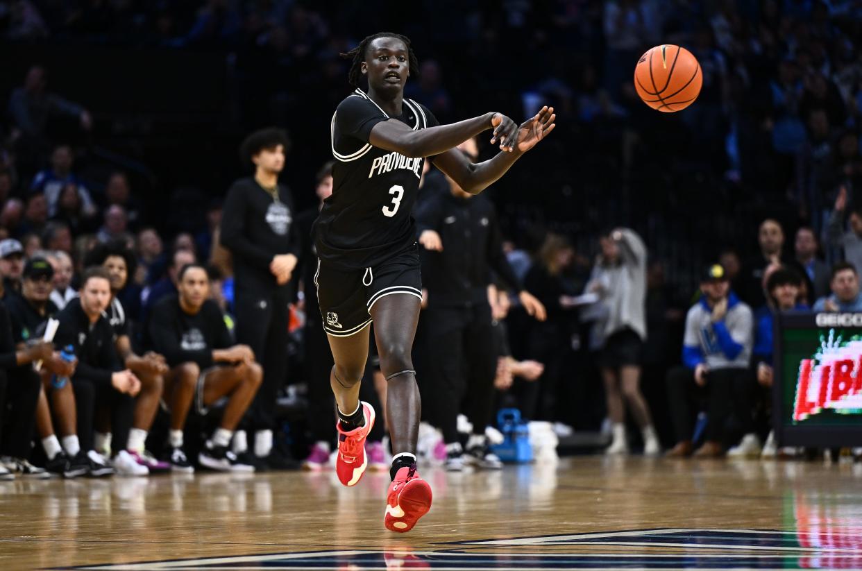 Feb 4, 2024; Philadelphia, Pennsylvania, USA; Providence Friars guard Garwey Dual (3) passes the ball during his game against the Villanova Wildcats in the first half at Wells Fargo Center.