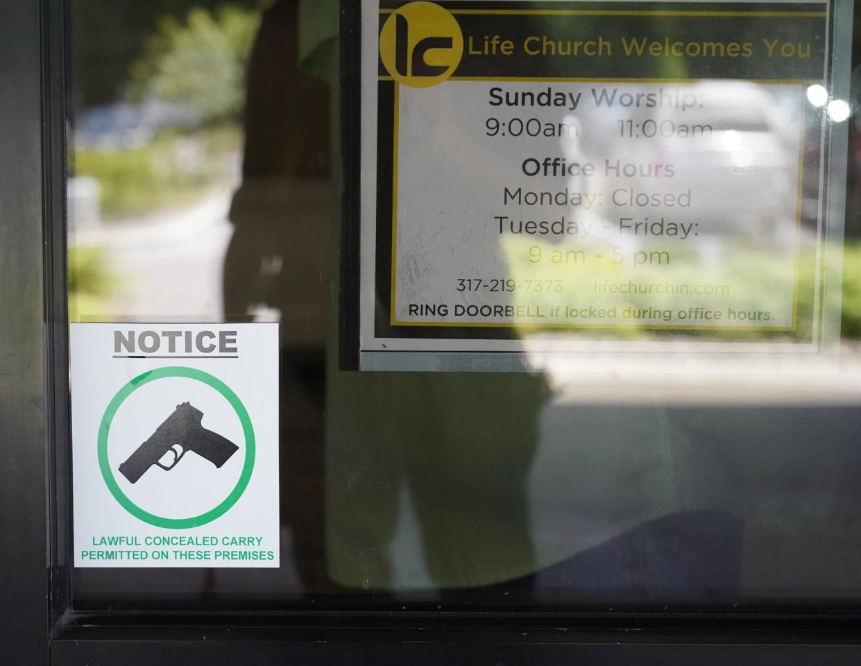 A sticker on the door at Life Church in Noblesville on Sunday, June 30, 2024, advises that allows concealed firearms may be carried there.