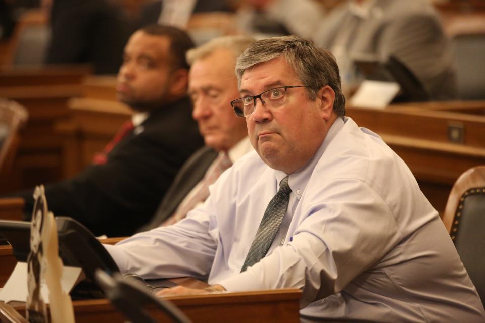 Rep. Ken Rahjes, R-Agra, looks up at the voting board in the House chambers as the Legislature worked past midnight and into early Wednesday.